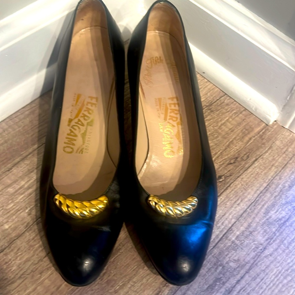 Salvatore ferragamo black with gold accent. Size 7 1/2. Beautiful leather